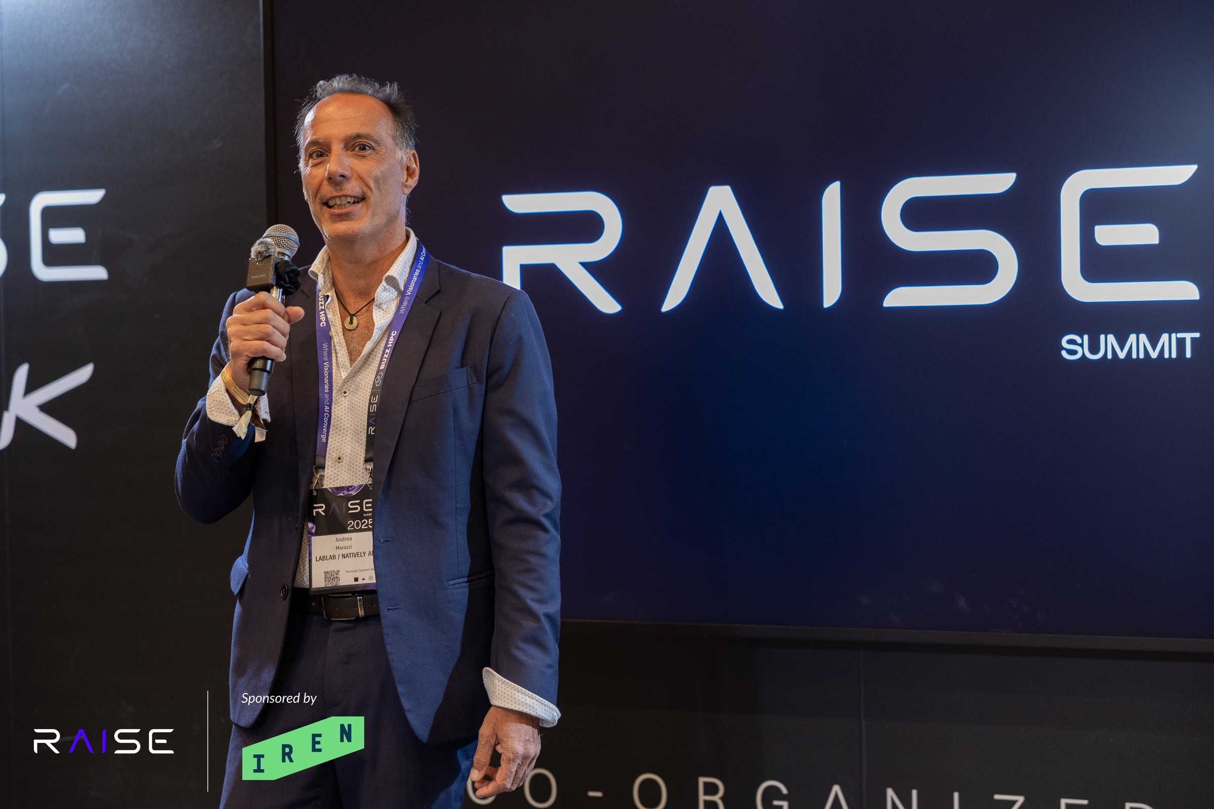 Andrea giving a speech at Raise Your Hack